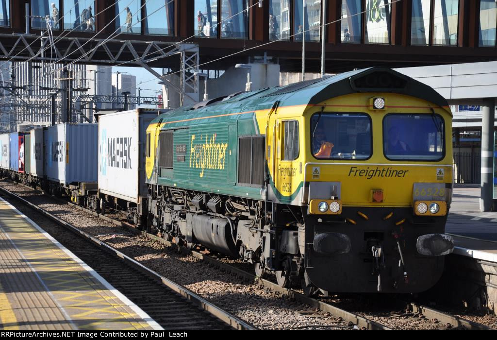 Class 66 leads container train though the station